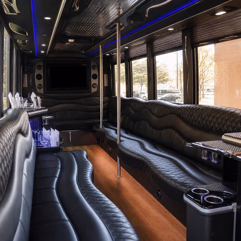 Friends laughing during a Newark party bus celebration