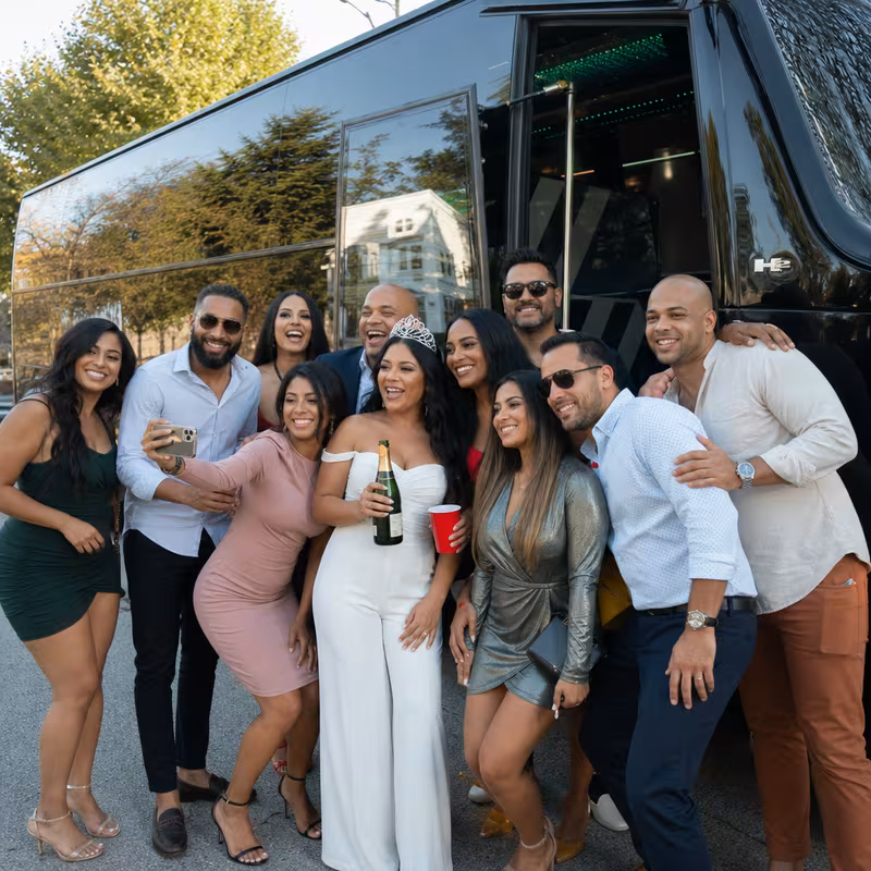 Party bus interior with wraparound leather seating and LED lighting in Newark