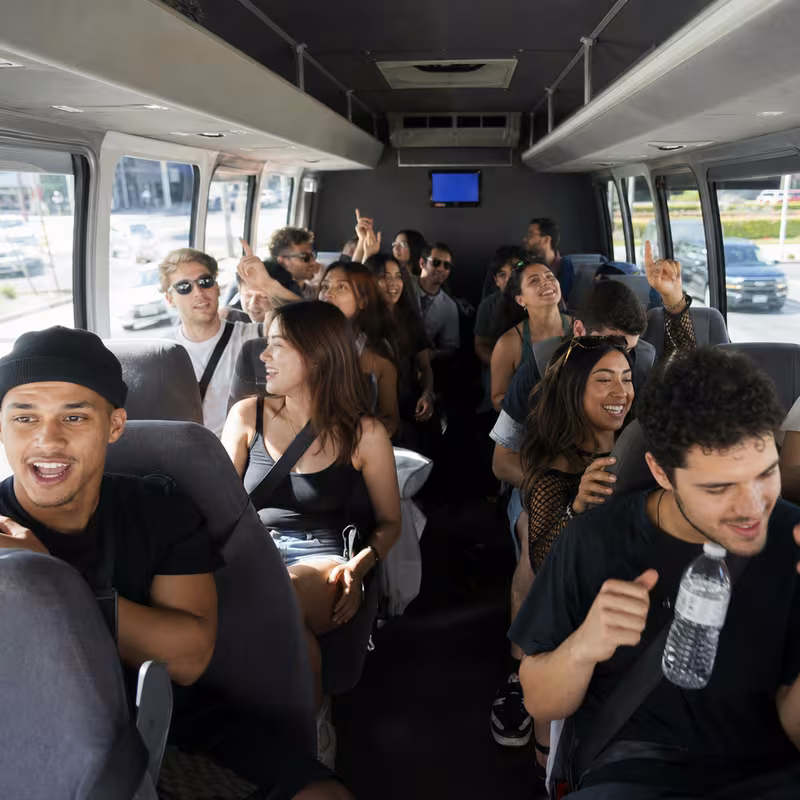 Party bus interior with wraparound leather seating and LED lighting in Newark