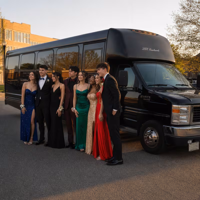 Group boarding a white charter bus for Prom & Homecoming Transportation transportation in Newark