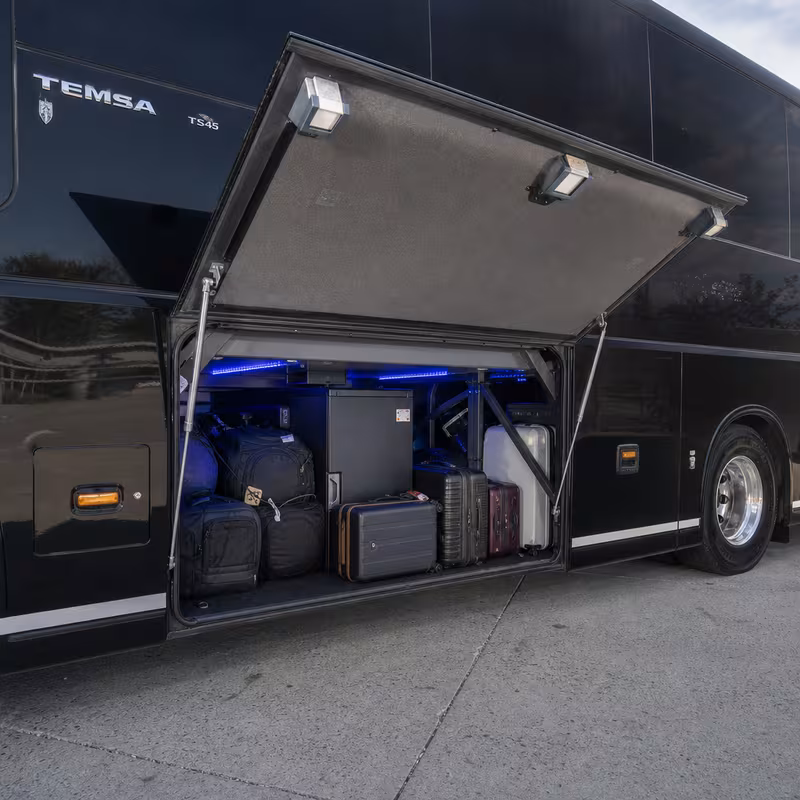 Party bus interior with wraparound leather seating and LED lighting in Newark