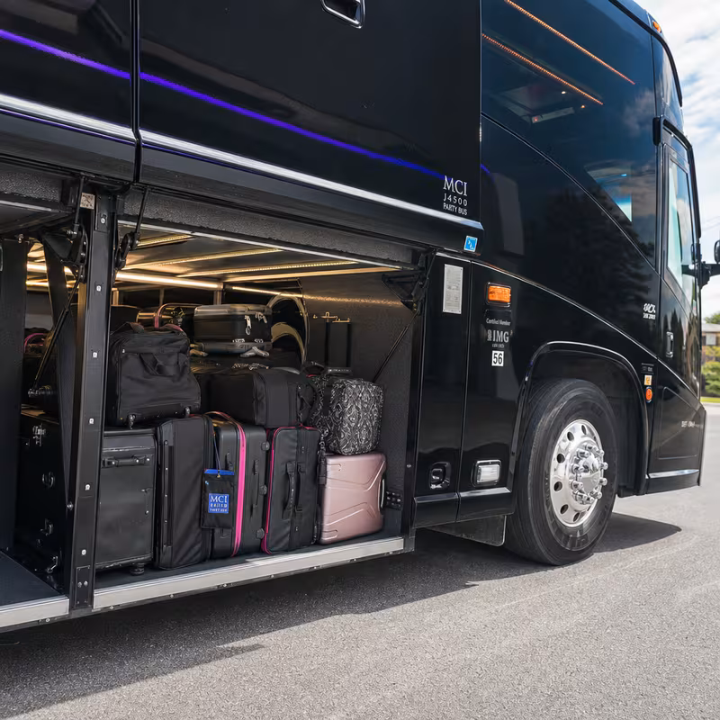 Party bus interior with wraparound leather seating and LED lighting in Newark