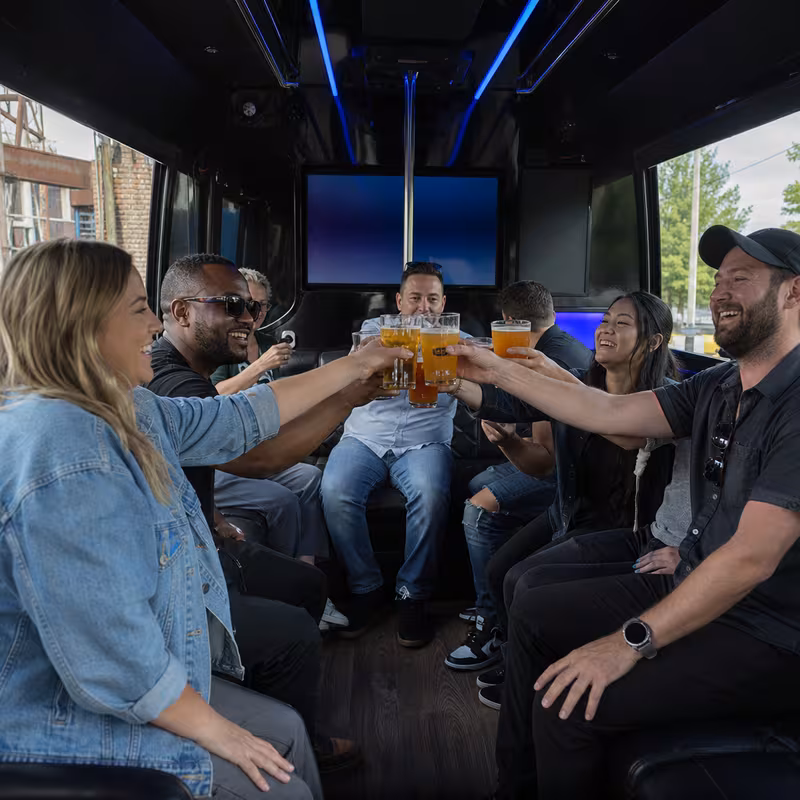 Group boarding a white charter bus for Winery & Brewery Tour Transportation transportation in Newark